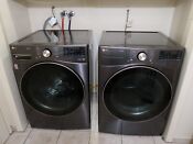 Lg Side By Side Washer Dryer Set With Front Load Washer And Gas Dryer In Black